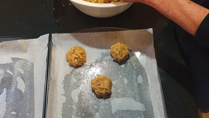 Preparing the Anzac Biscuit on baking trays