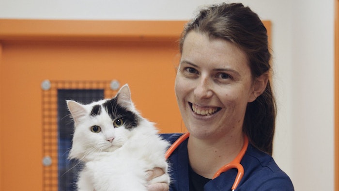 GOTAFE student holding cat and smiling