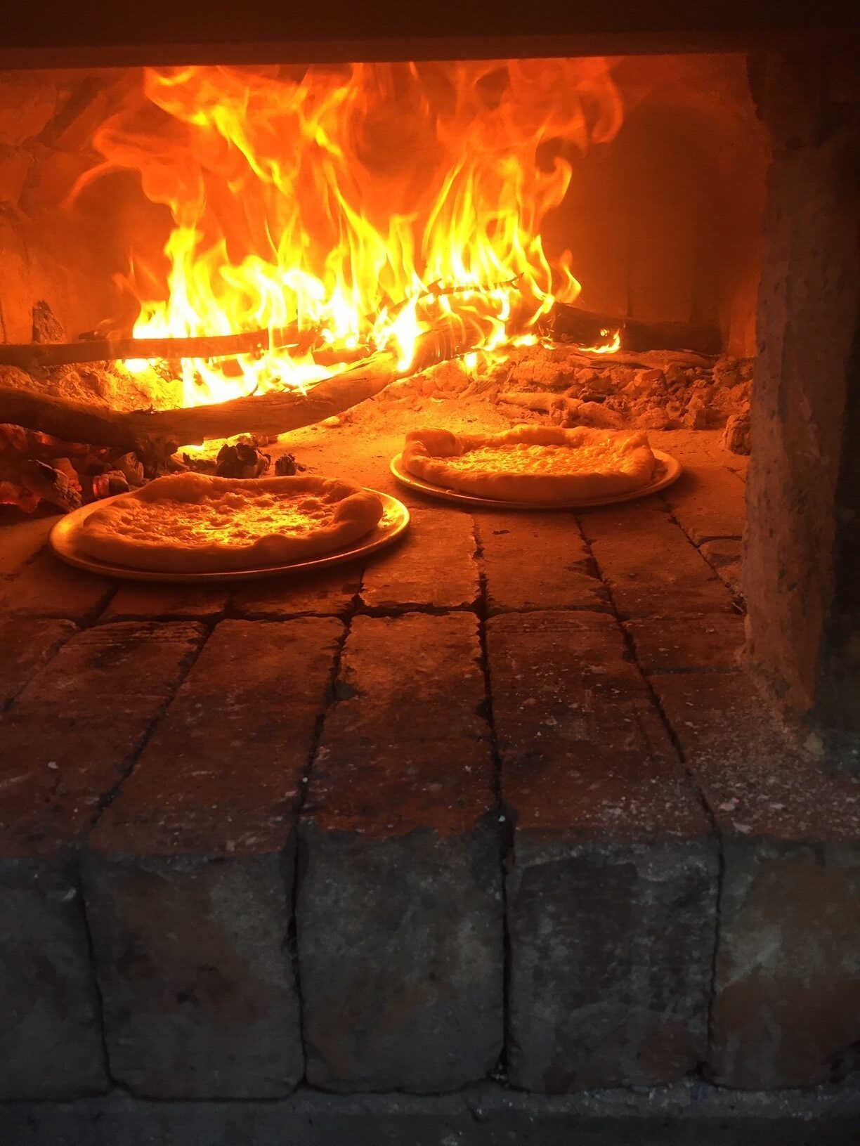 Eric Pizza 3 in a pizza oven