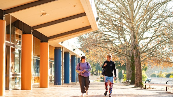Two students walking and talking