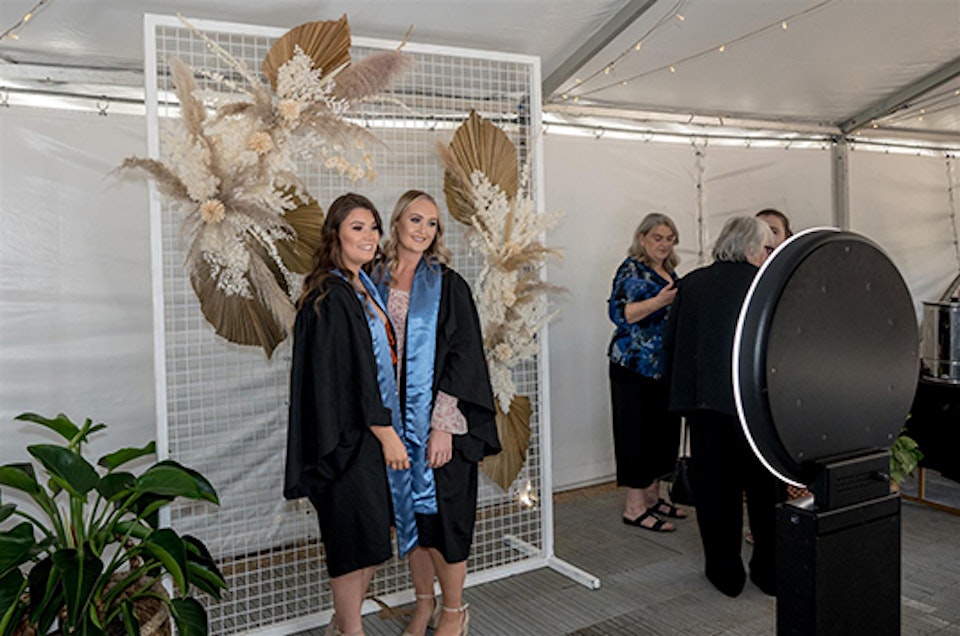 Graduates getting photos taken at Wangaratta event