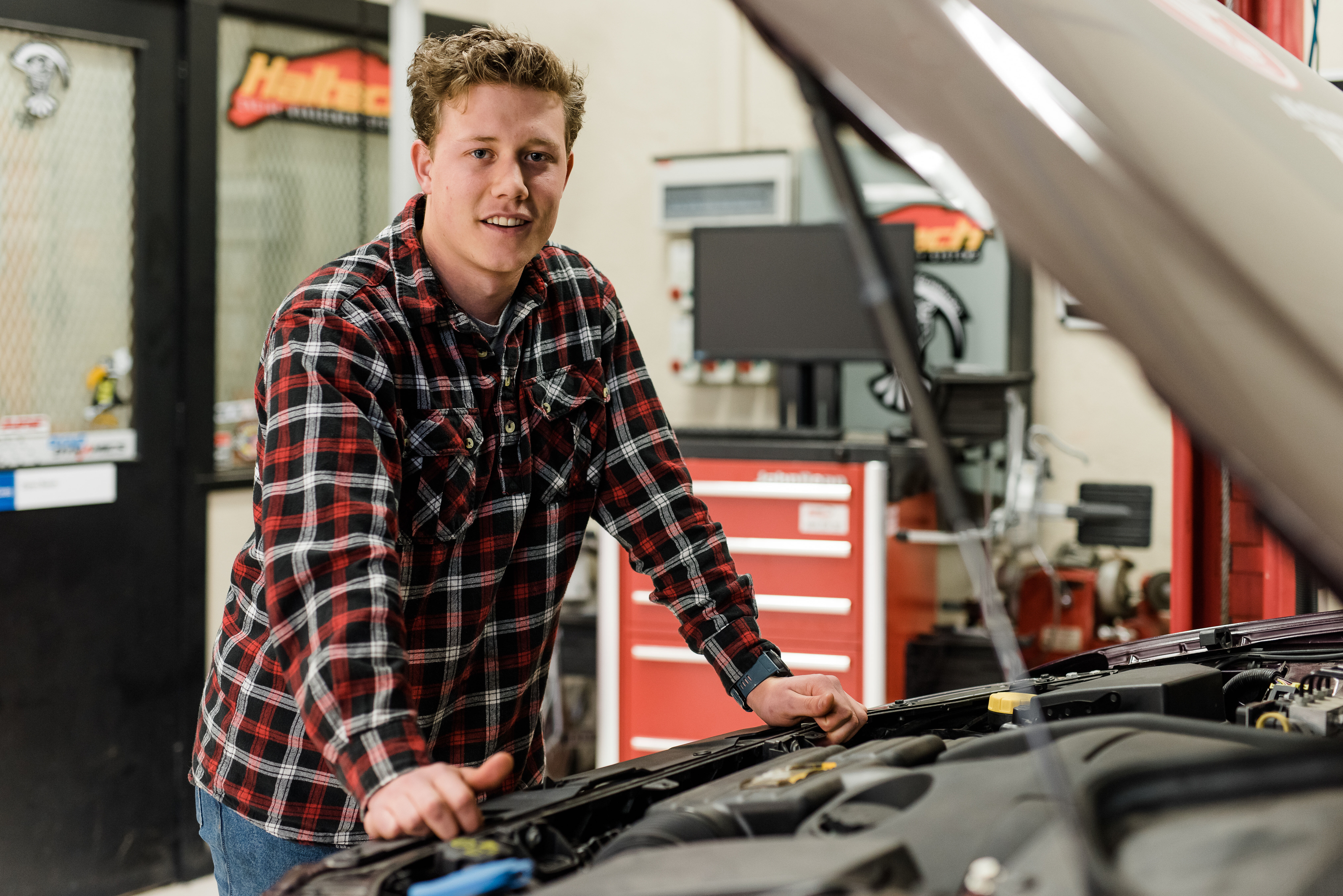 Automotive Student Next To Car
