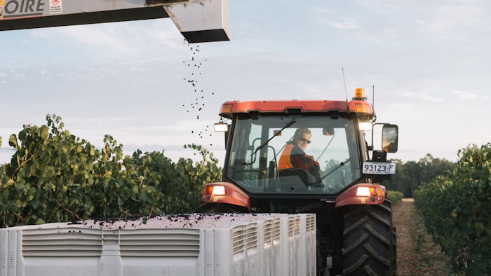 Tractor among vineyard