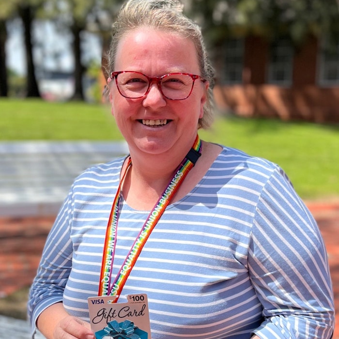 Kaelene Holmes sitting on a bench.