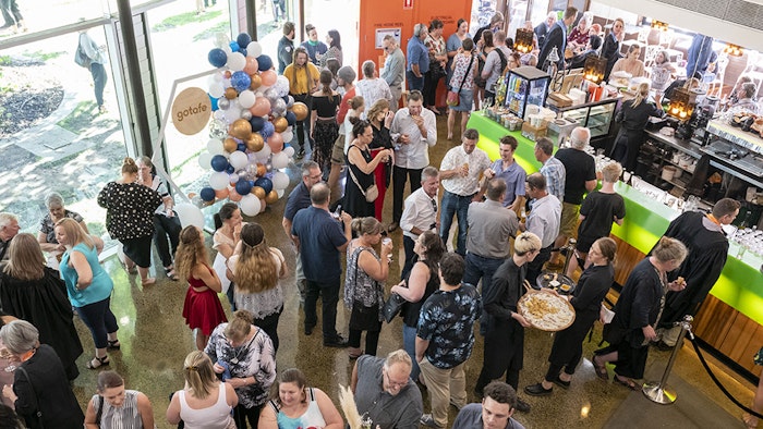GOTAFE Graduates in front of balloons